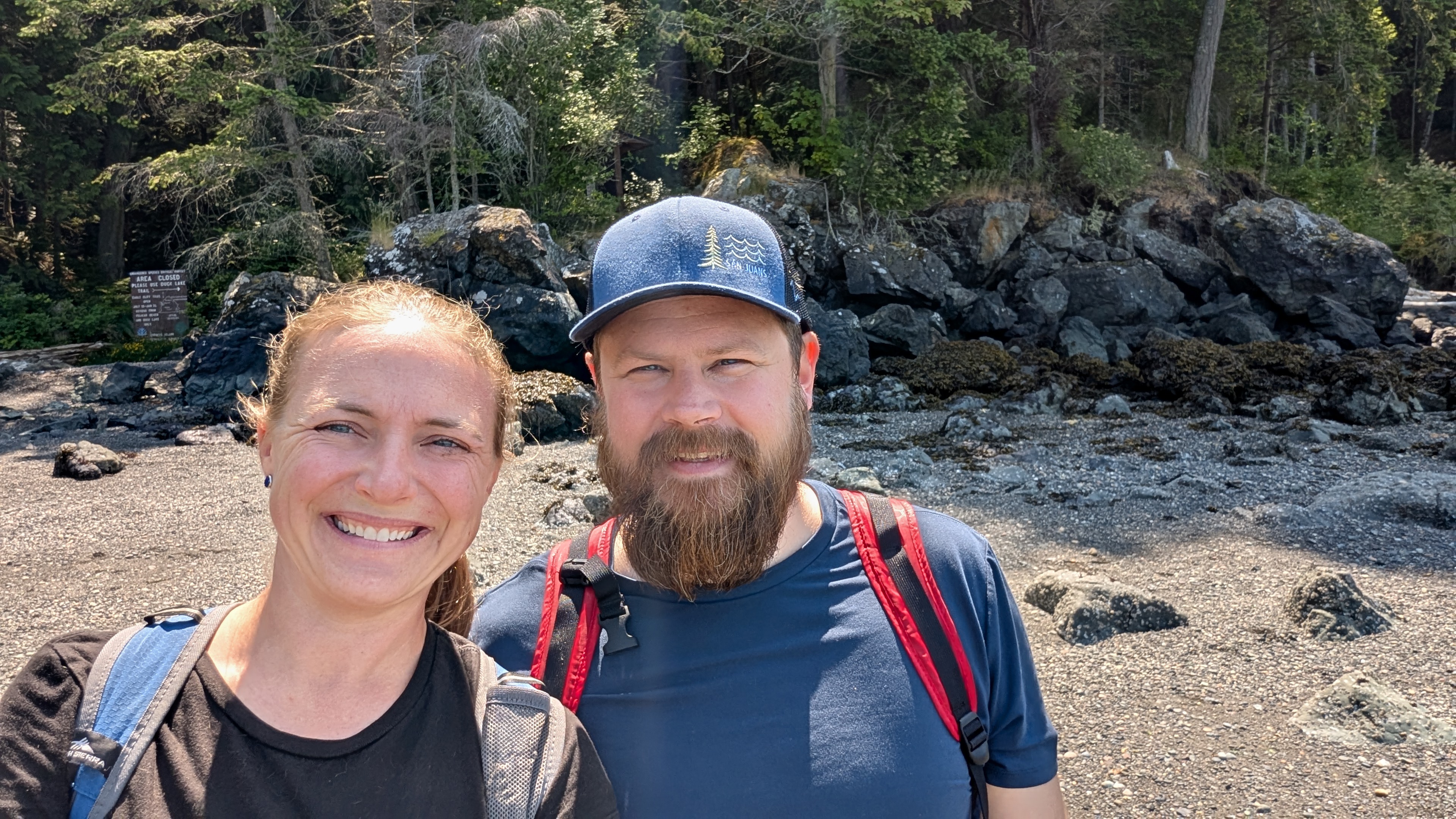 Rachel and Brian selfie on the beach at Smuggler’s Cove on Cypress Island