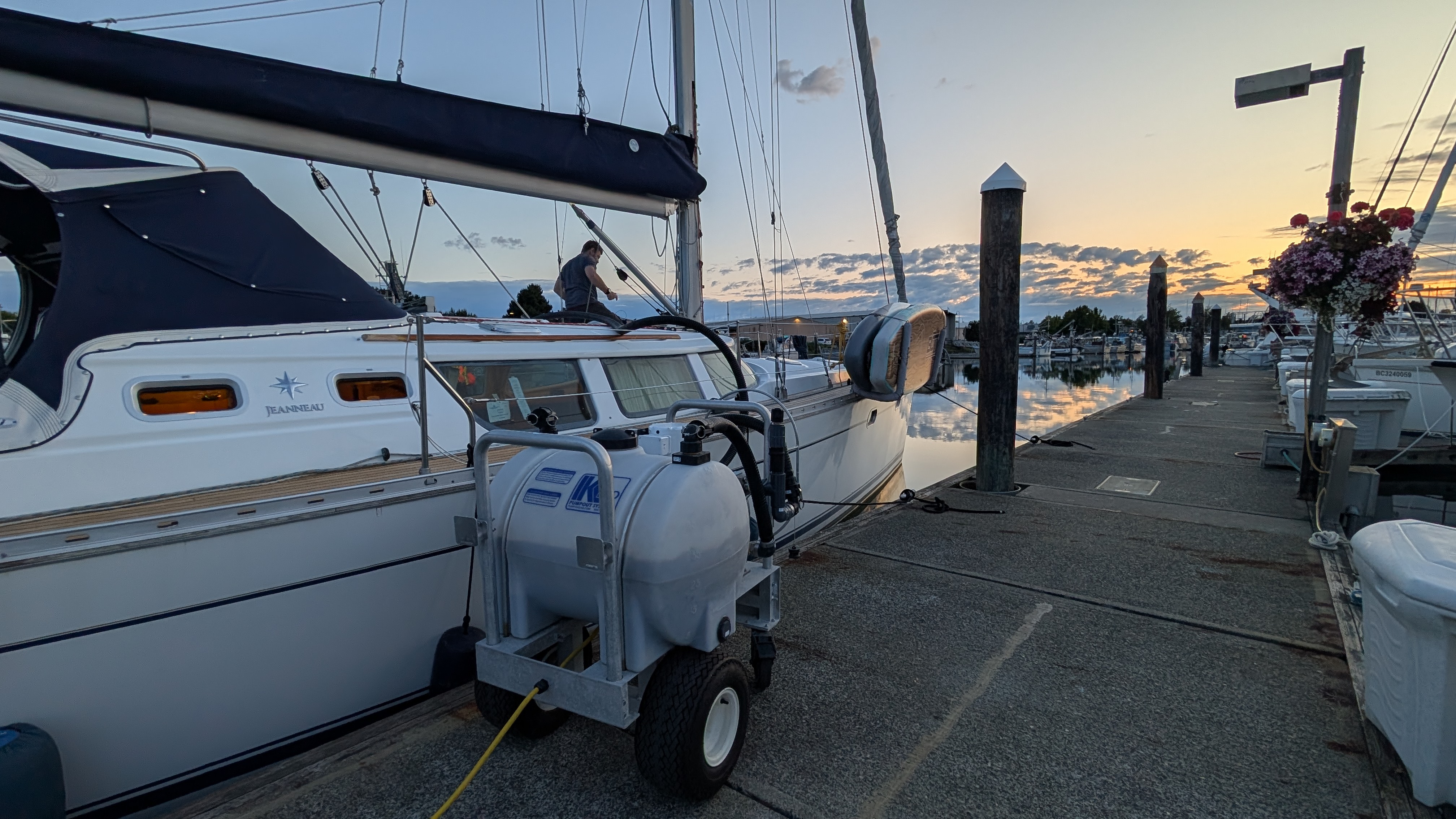 Pumping out the holding tank at the Bellingham marina dock at sunset