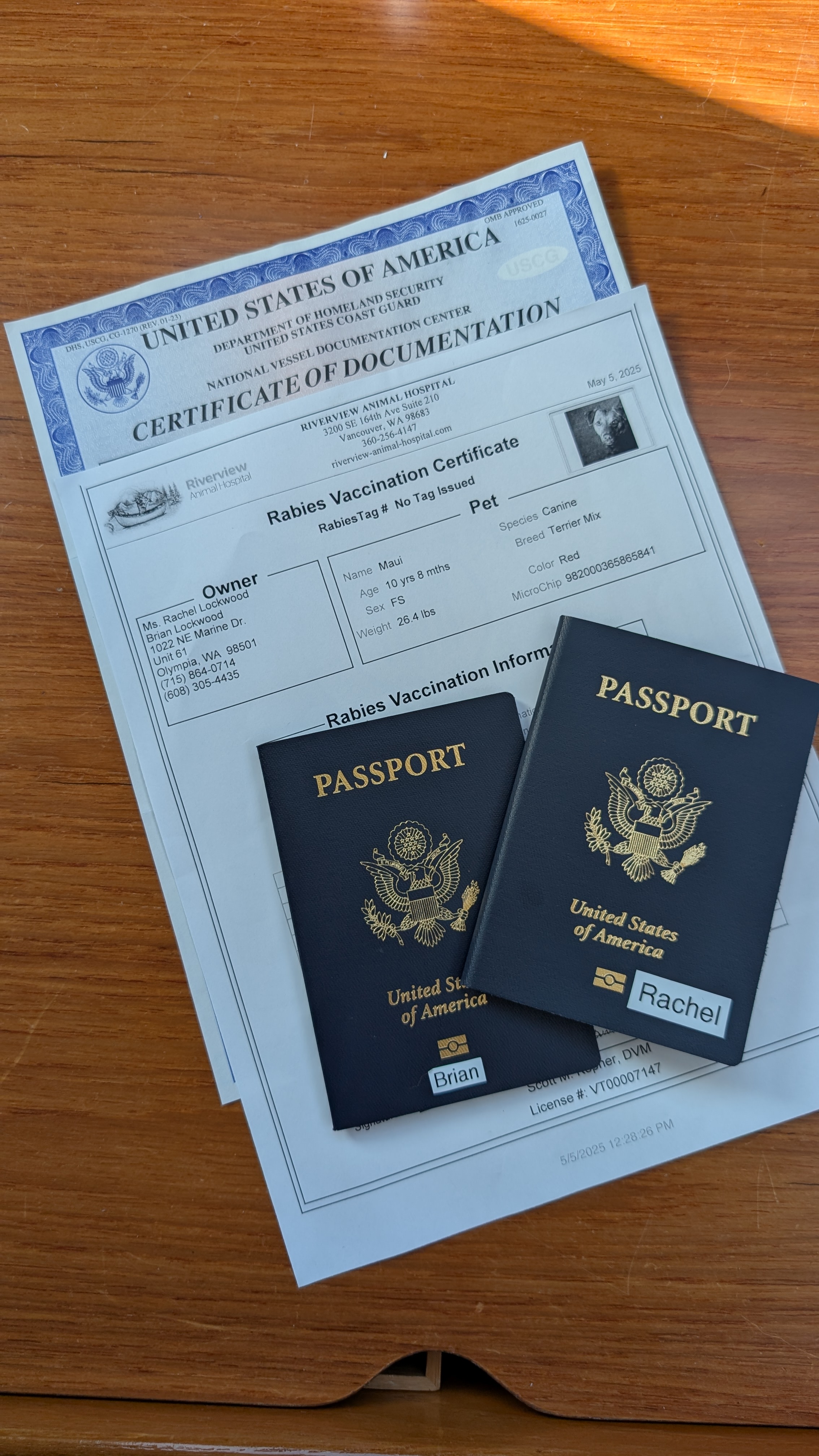 US passports, vessel documentation, and Maui&rsquo;s rabies certificate ready for Canadian customs