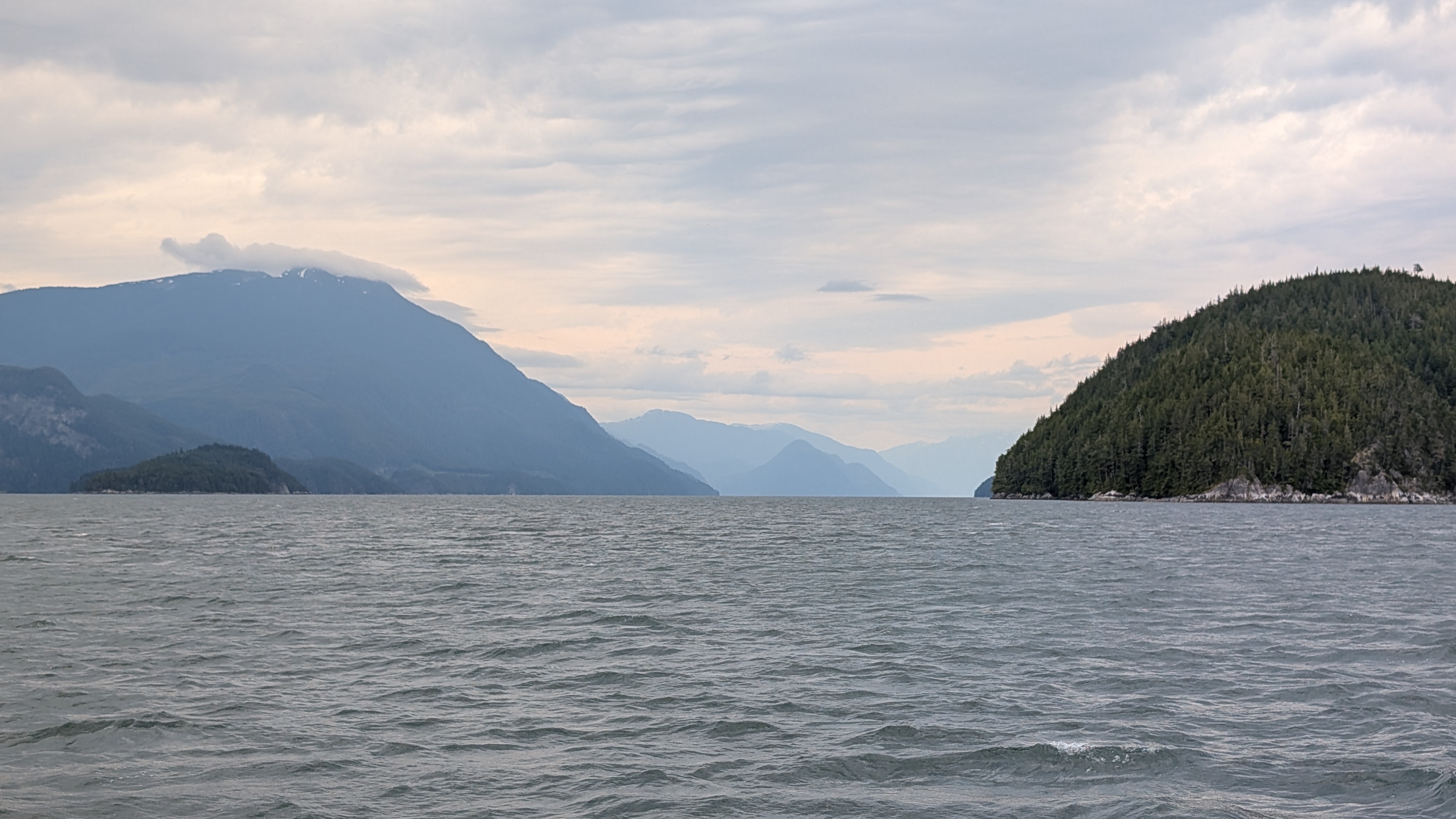 Hazy mountains and choppy water while motoring through Johnstone Strait