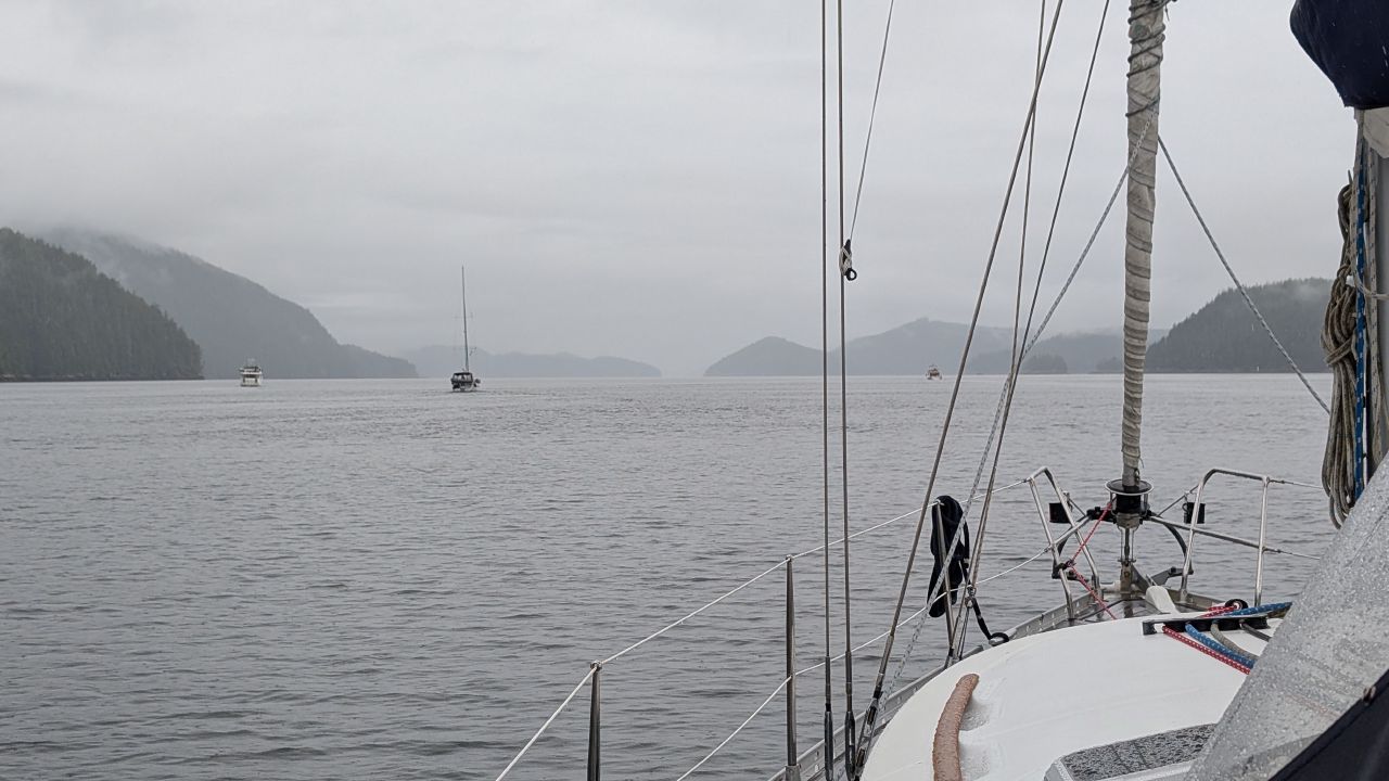 Our flotilla of buddy boats motoring together through foggy channels in the Broughtons