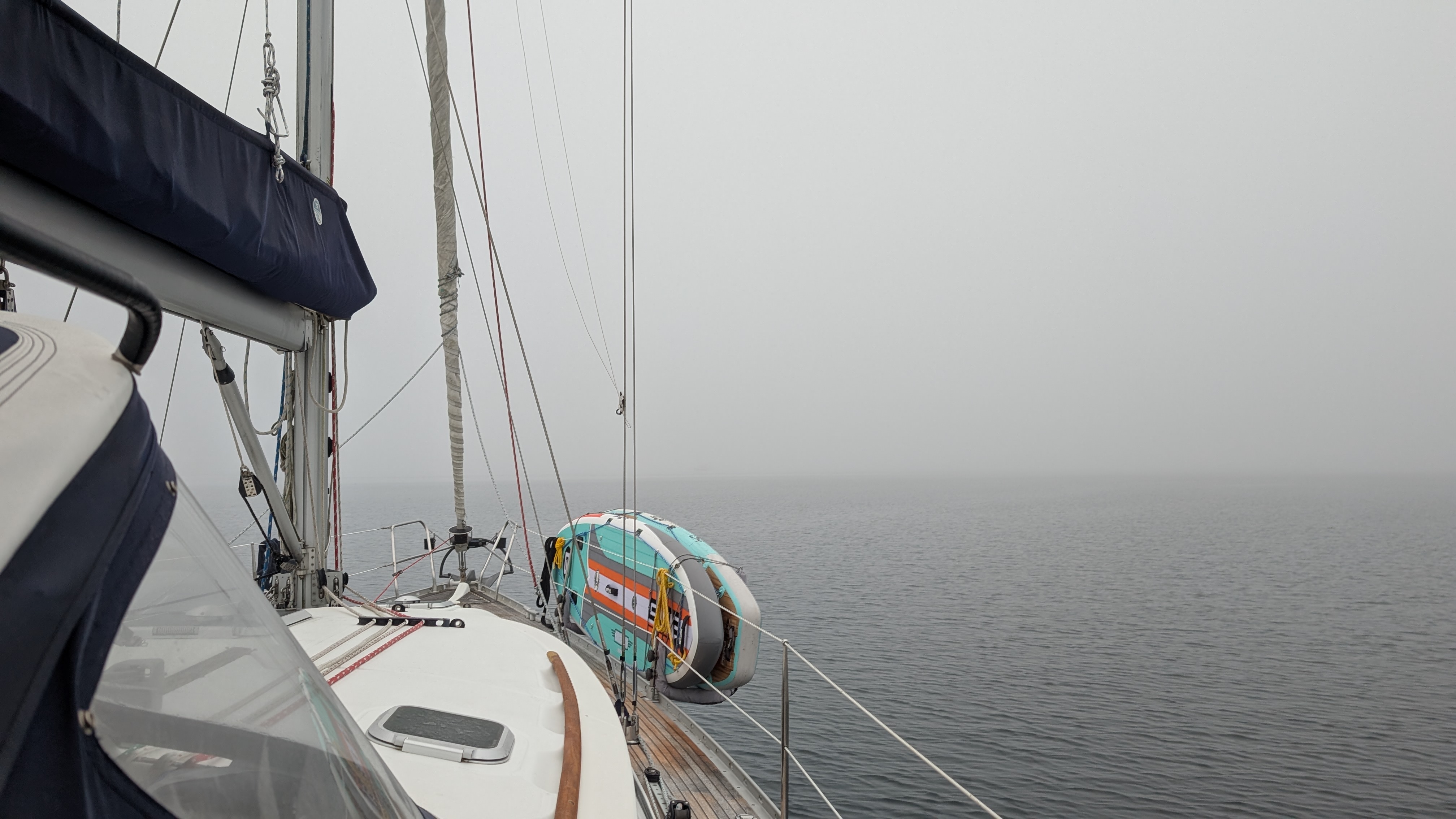 SV Yahara&rsquo;s deck disappearing into dense fog during a passage north of Vancouver Island