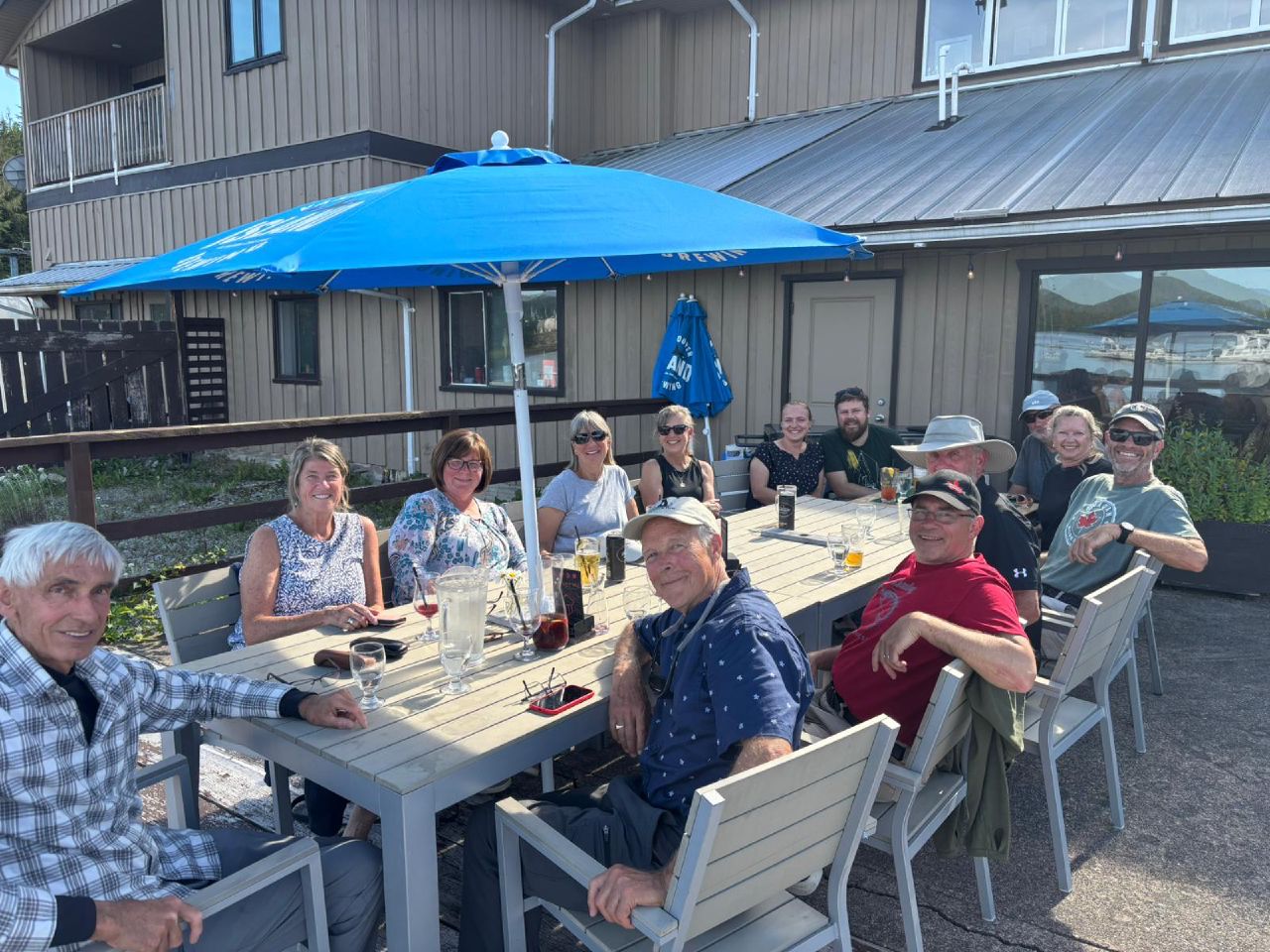 Flotilla crew enjoying dinner on the outdoor patio at the Shearwater restaurant on a sunny evening