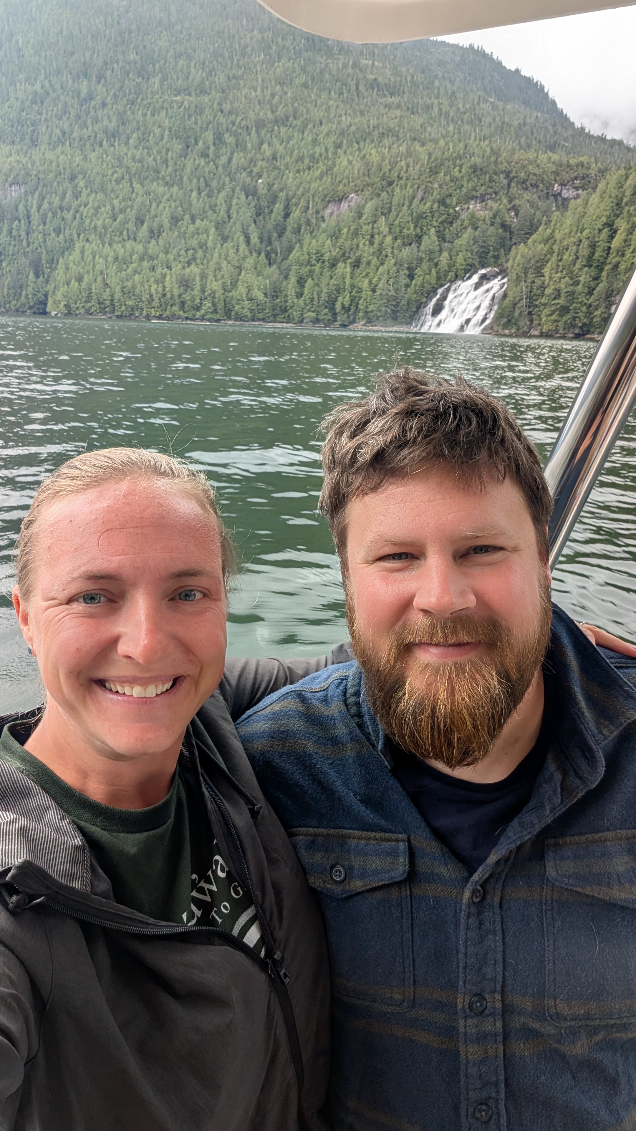 Rachel and Brian selfie with the epic Poison Cove waterfall in the background