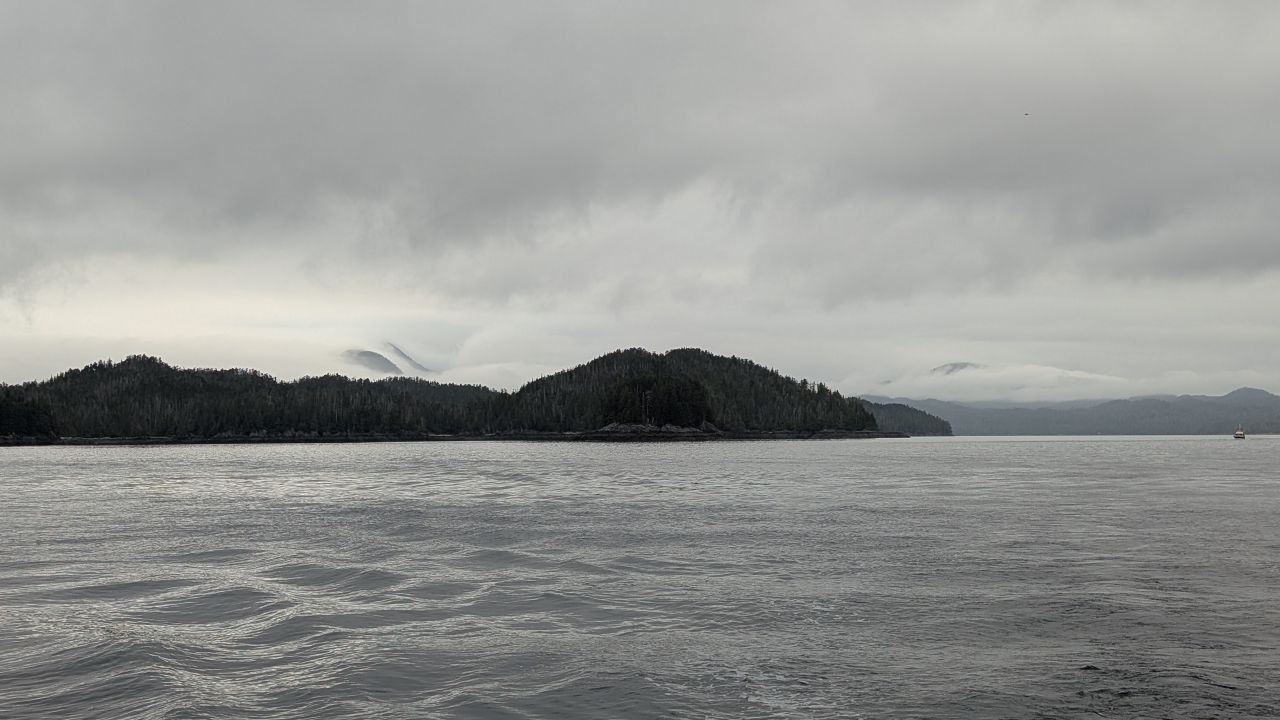 Overcast skies and low clouds hanging over forested islands outside Princess Royal