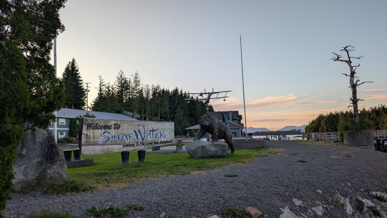 Welcome to Shearwater sign with a bear statue, Gateway to the Great Bear Rainforest