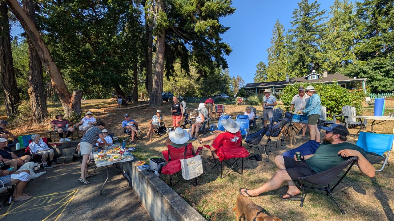 Cruisers gathered in lawn chairs under the trees for shared appetizers at the Ladysmith Yacht Club rendezvous
