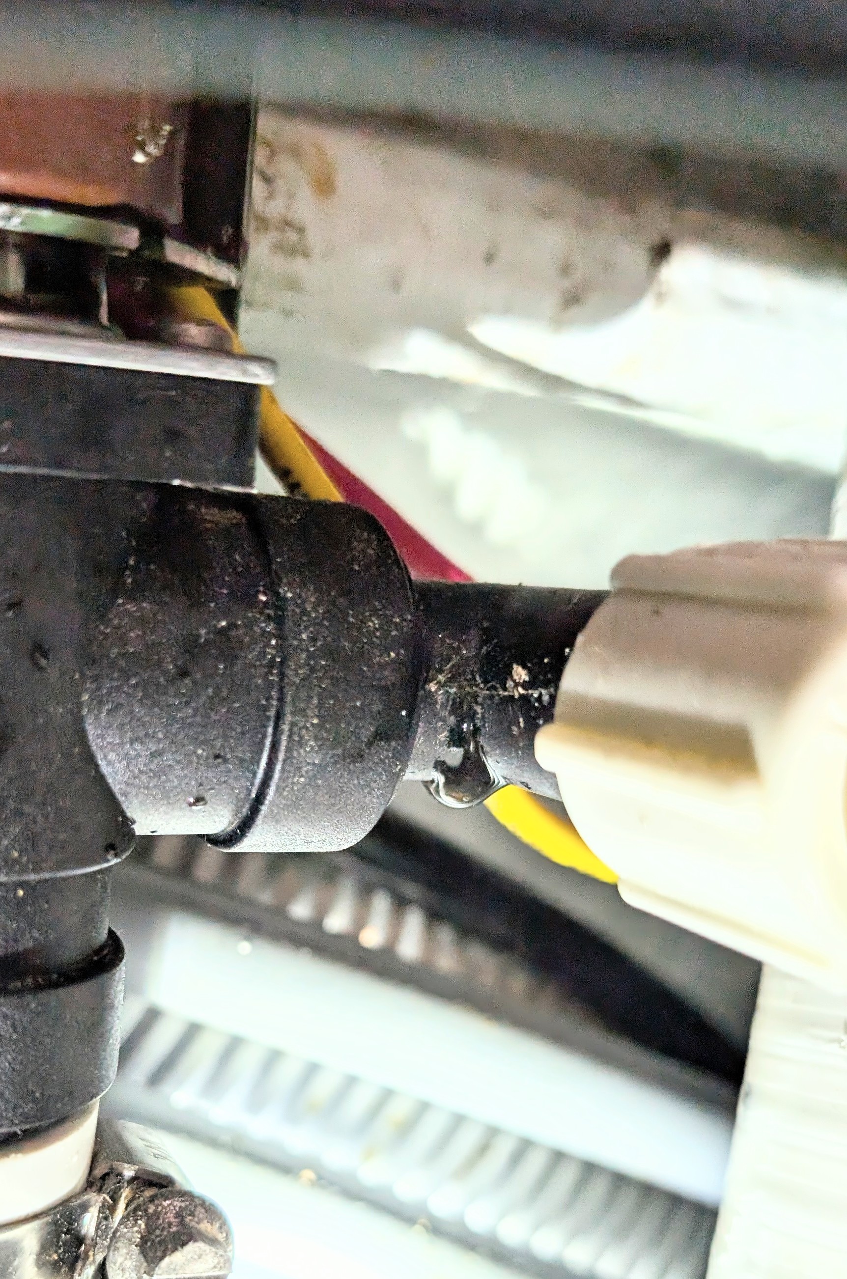 Close-up of the leaking plumbing fitting in the forward head that was the source of the water leak